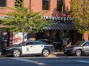 A police car is parked outside of Starbucks Coffee on Franklin St. on Friday, Oct. 14, 2022. The Chapel Hill Police Department has been implementing speed traps and pulling cars over for exceeding the speed limit.
