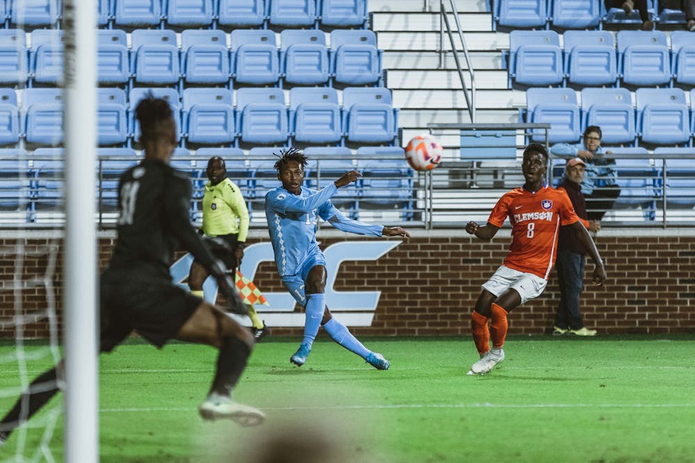 <p>UNC freshman Key White (13) attempts to score in first half of the men's soccer match against Clemson on Monday, Oct. 3, 2022, at Dorrance Field. Clemson defeated UNC 1-0.</p>