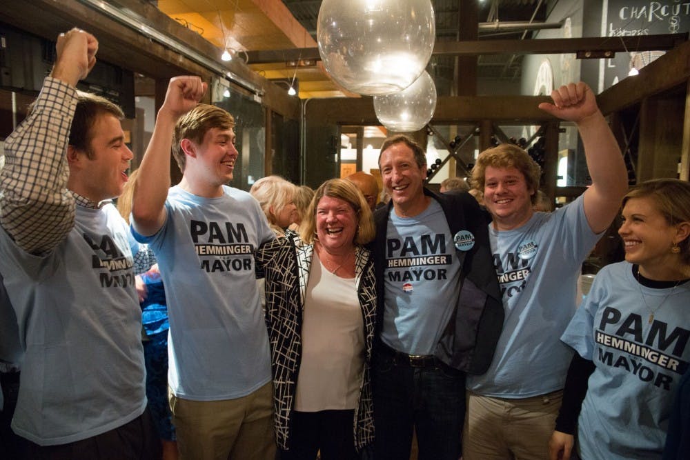 Chapel Hill Mayor Pam Hemminger (middle left) celebrates her sweeping re-election victory with her husband and children at the City Kitchen restaurant in 2017.&nbsp;
