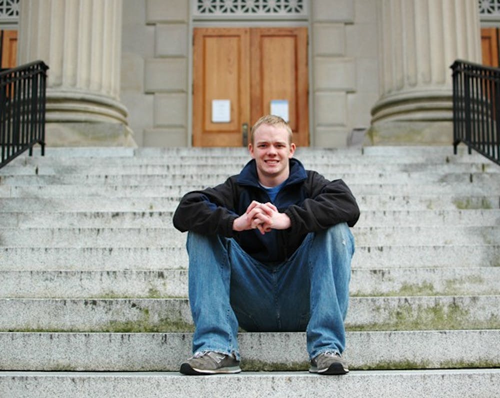 Scott Rodgers, a junior economics major, sits in front of Wilson Library on Wednesday.  DTH/ Ben Pierce