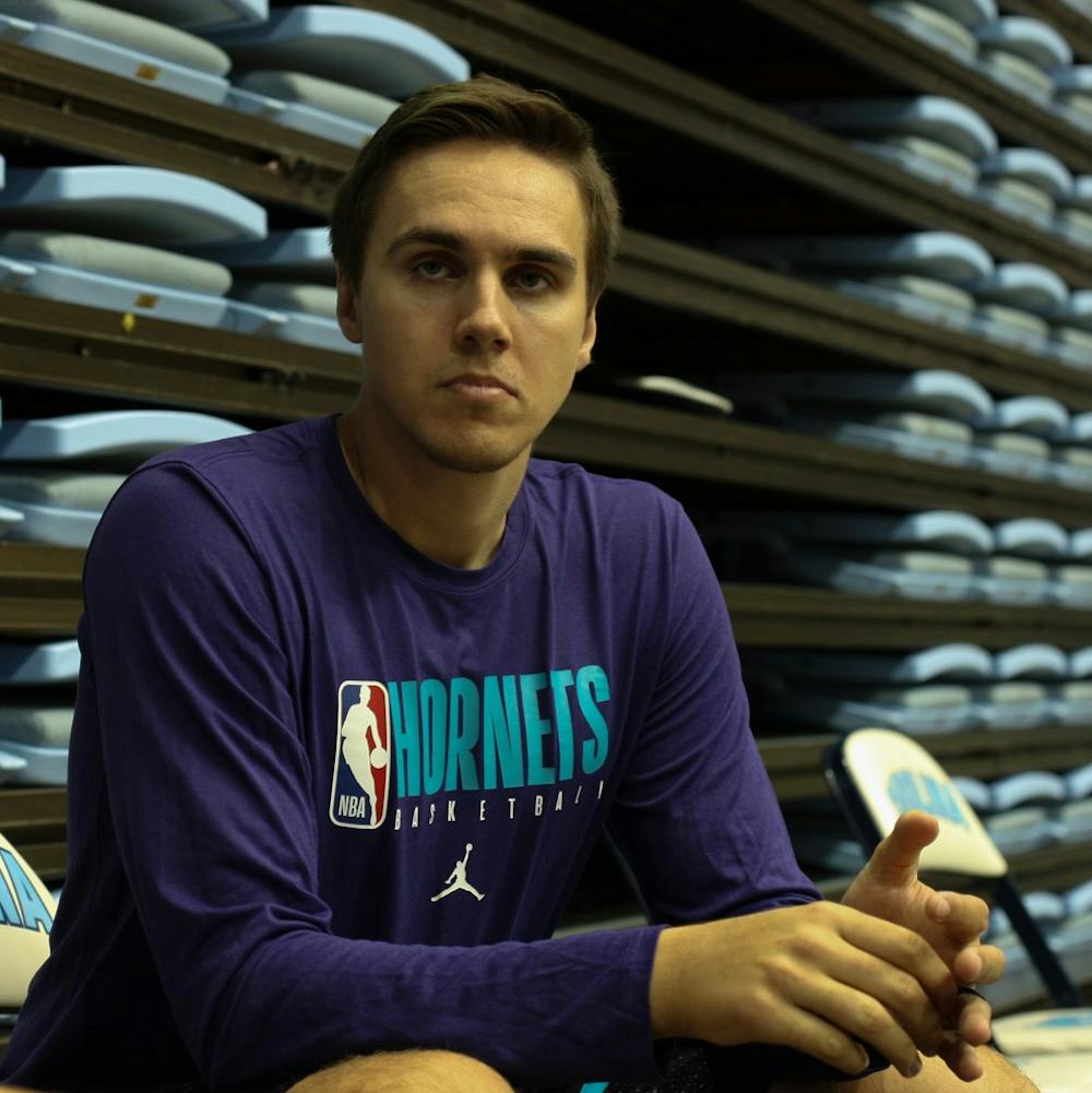 <p>Former UNC forward and current Charlotte Hornets assistant video coordinator Jackson Simmons, pictured on Friday, Oct. 4, 2019, returned to the Smith Center for Hornets training camp last week.</p>