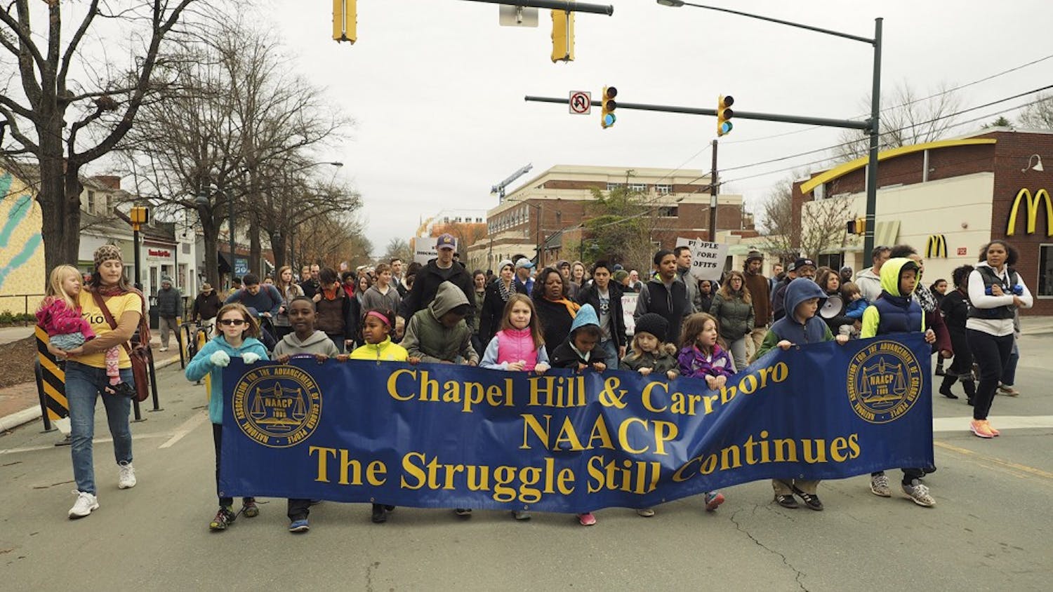 Local Chapel Hill/Carrboro youth lead the march from Peace and Justice Plaza to First Baptist Church during Monday's MLK Jr Day Celebration.