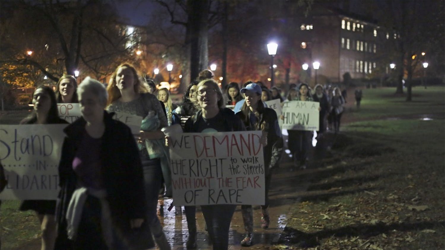 Women gather to march in "Take Back the Night," a protest against male-patterned violence against women on Thursday night. 