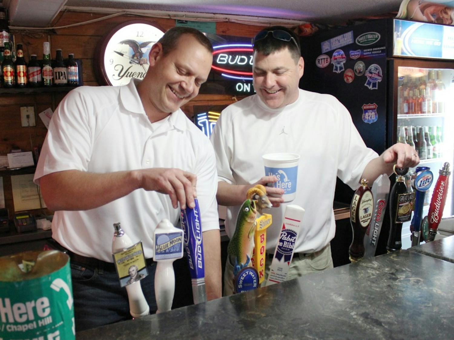 Matt Mehok, left,  and Bennett Roberts officially announced that they are the new owners of the bar He's Not Here, after deciding to buy it in mid-January. "We have dedicated ourselves to being a part of this bar," said Mehok. They are working on getting the design of the iconic cup just right. 