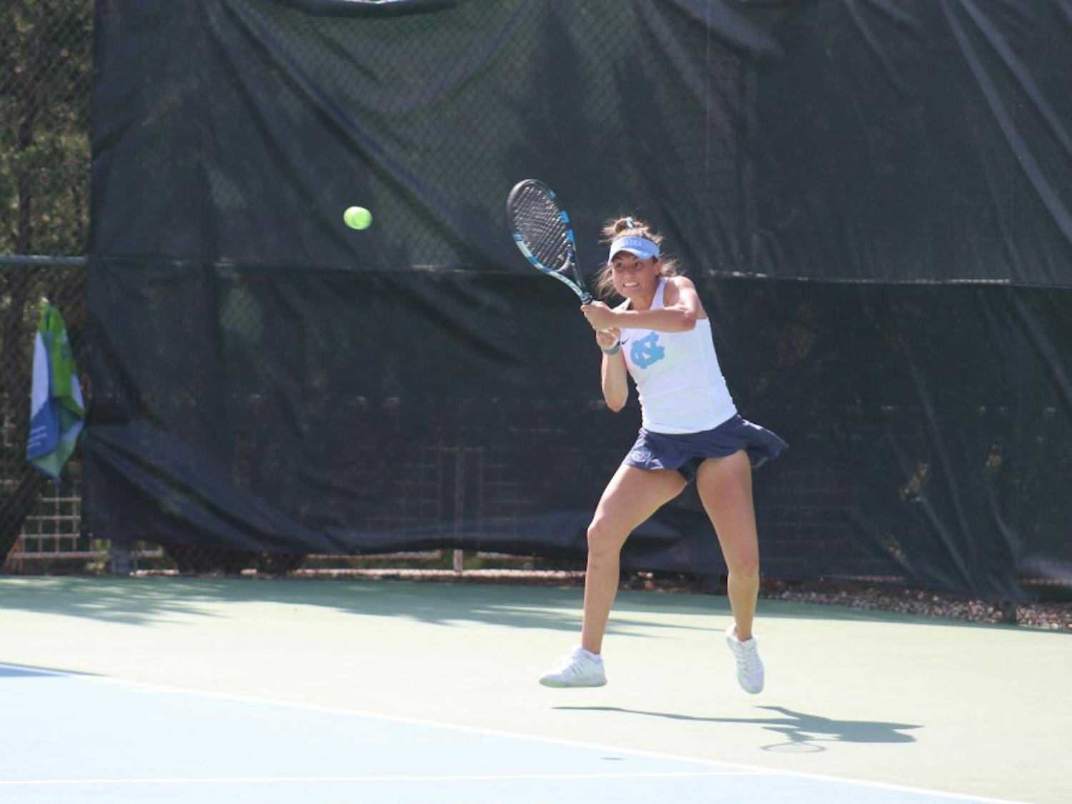 Sophomore Alexa Graham hits a backhand against Virginia on April 13 at the Cone-Kenfield Tennis Center.