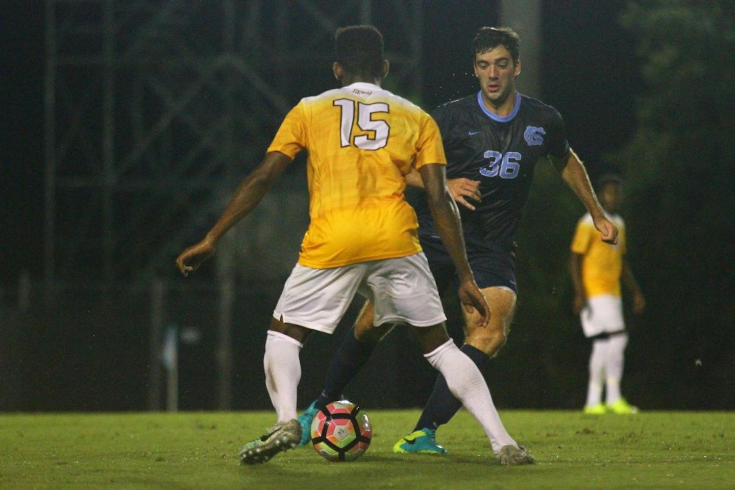 UNC forward Tucker Hume (36) dribbles past VCU defender RJ Roberts (15)&nbsp;on Monday night. Hume scored the game-winning shot in the final 10 minutes&nbsp;to lift the Tar Heels to a 3-2 victory.