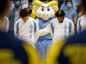 Rameses stands for the playing of the national anthem at men before UNC basketball's home game against Michigan on Wednesday, Dec. 1, 2021. UNC won 72-51.