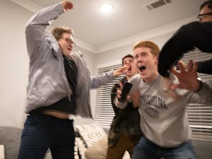Student Body President-Elect Reeves Moseley (third from left) reacts to learning that he won the vote for student body president in an apartment in Carolina Square on Wednesday, Feb. 11, 2020. Moseley won about 70% of the vote.