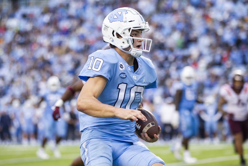 UNC first-year quarterback Drake Maye (10) seeks an open pass during a home football game at Kenan Stadium against Virginia Tech on Saturday, Oct. 1, 2022. UNC won 41-10.