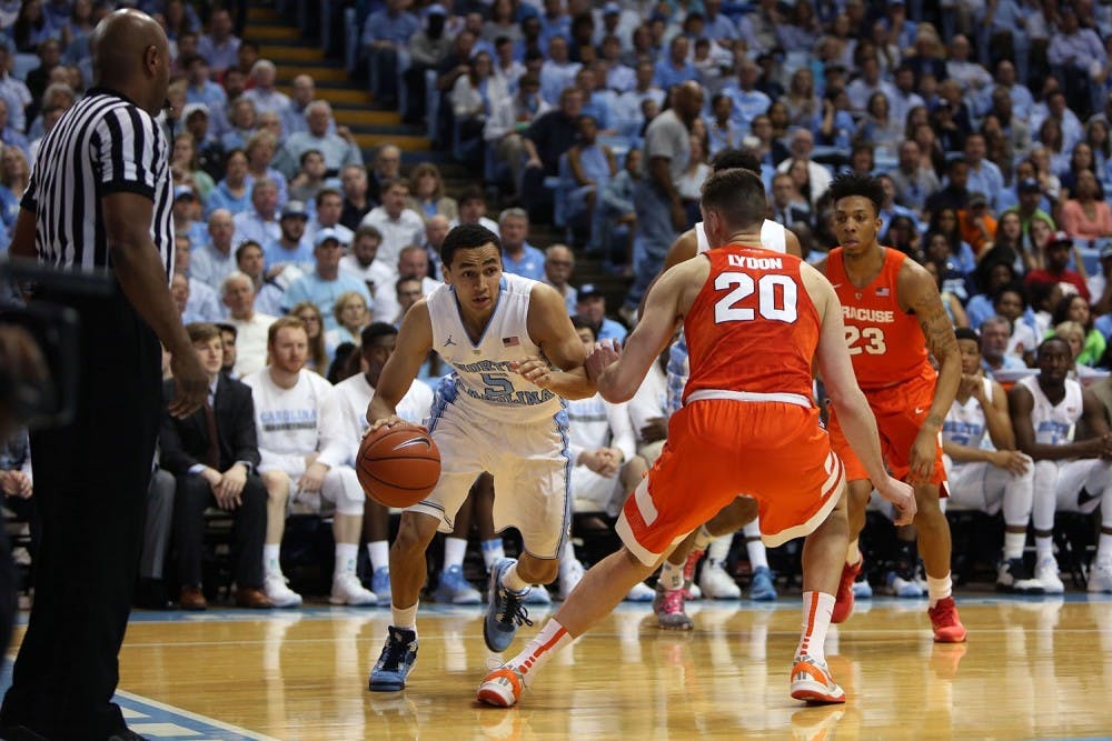 Guard Marcus Paige (5) drives along the baseline to the basket in a game against Syracuse in February 2015.&nbsp;