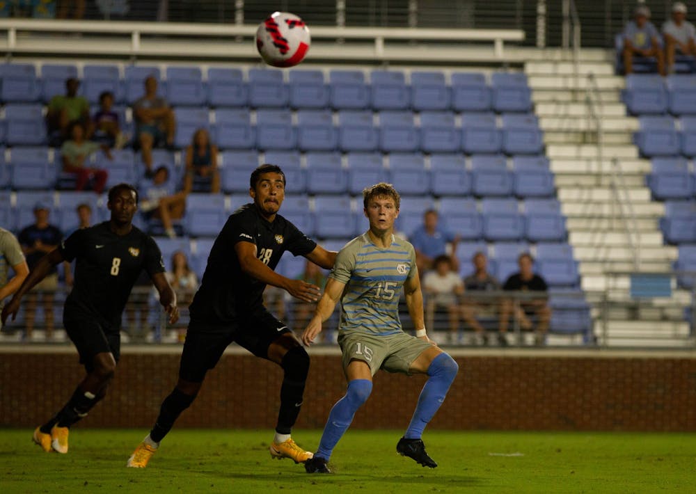 UNC sophomore defender Riley Thomas (15) eyes the ball at the soccer game against Virginia Commonwealth on Aug. 29 in Chapel Hill. UNC tied 1-1.