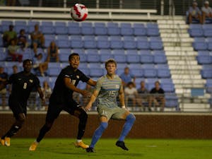 UNC sophomore defender Riley Thomas (15) eyes the ball at the soccer game against Virginia Commonwealth on Aug. 29 in Chapel Hill. UNC tied 1-1.