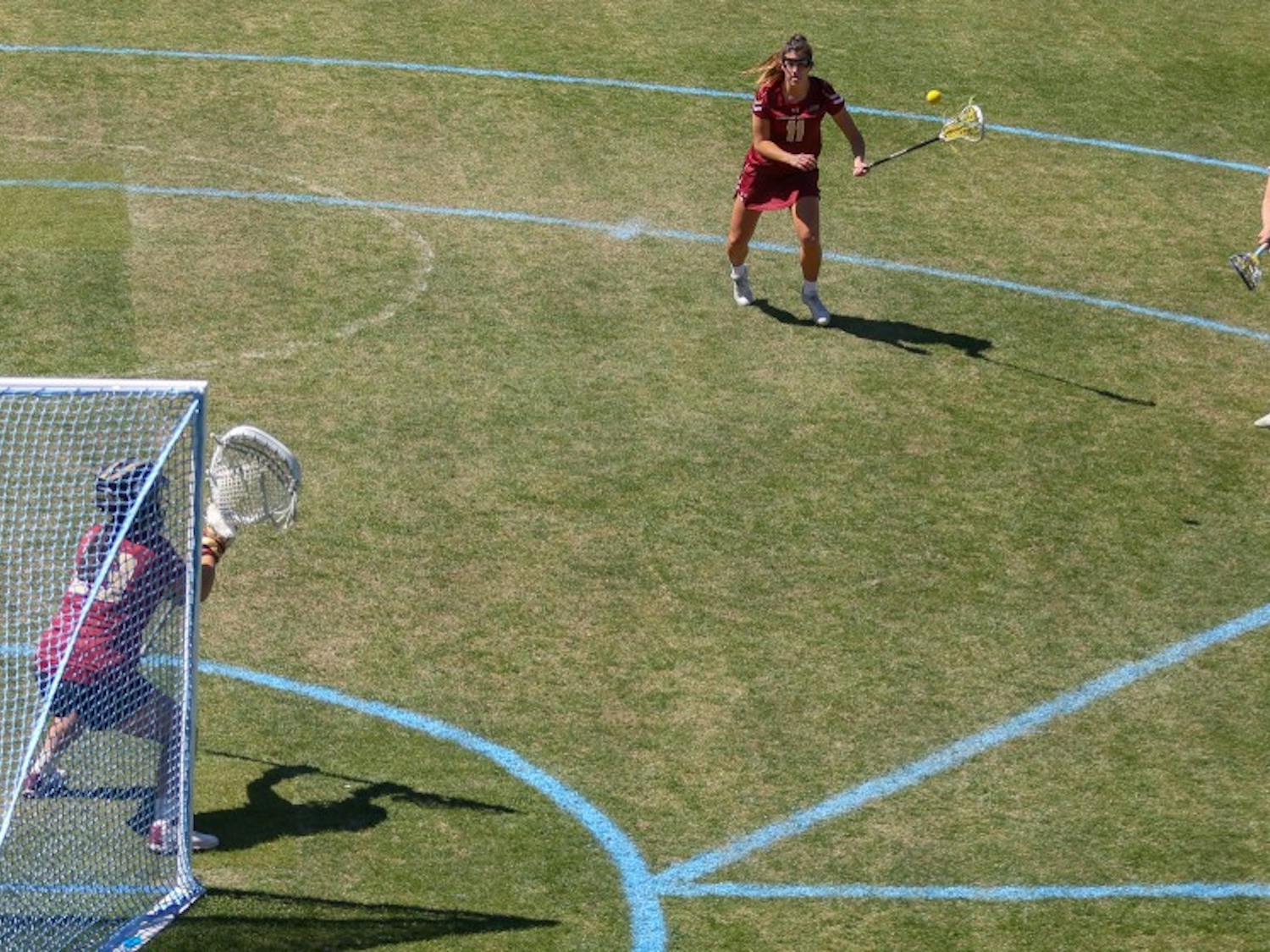 Junior attacker Katie Hoeg (8) makes a shot on goal against Boston College &nbsp;at the UNC Lacrosse Stadium on Saturday, March 23, 2019. Boston College defeated UNC 14-8.&nbsp;