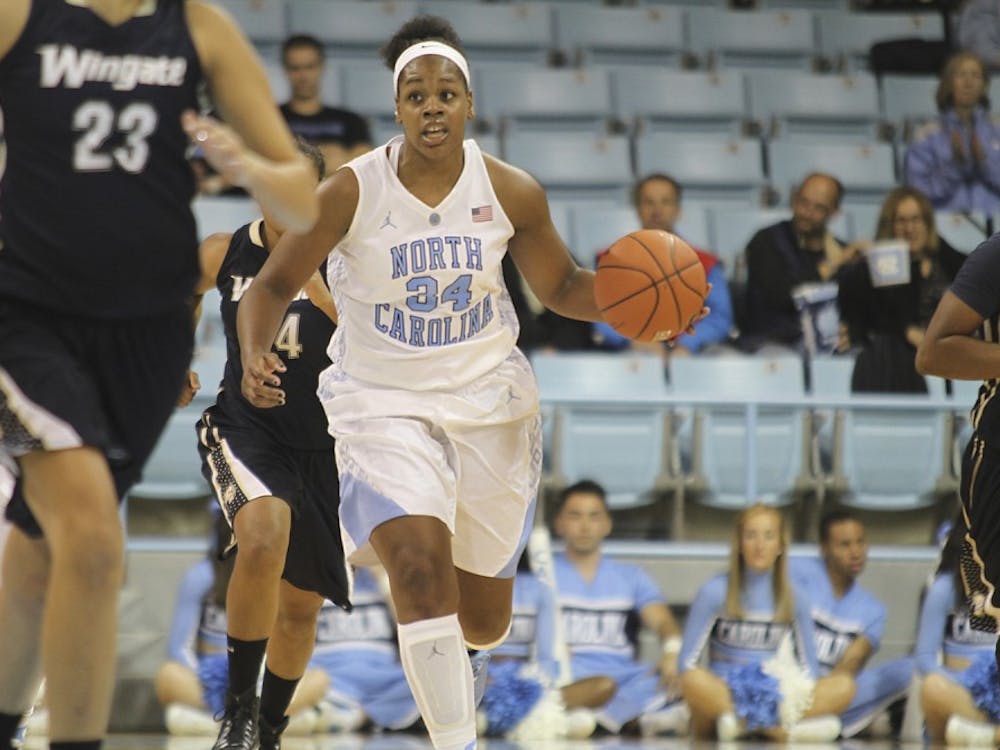 The UNC women's basketball team beat Wingate University 92-50 on Monday night. Xylina McDaniel dribbles towards the basket. McDaniel scored 7 points during the game.