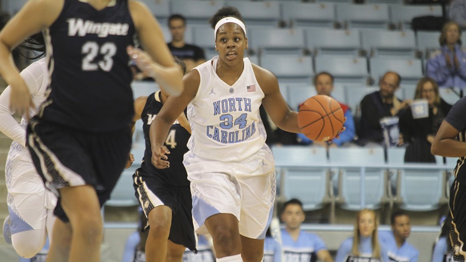 The UNC women's basketball team beat Wingate University 92-50 on Monday night. Xylina McDaniel dribbles towards the basket. McDaniel scored 7 points during the game.