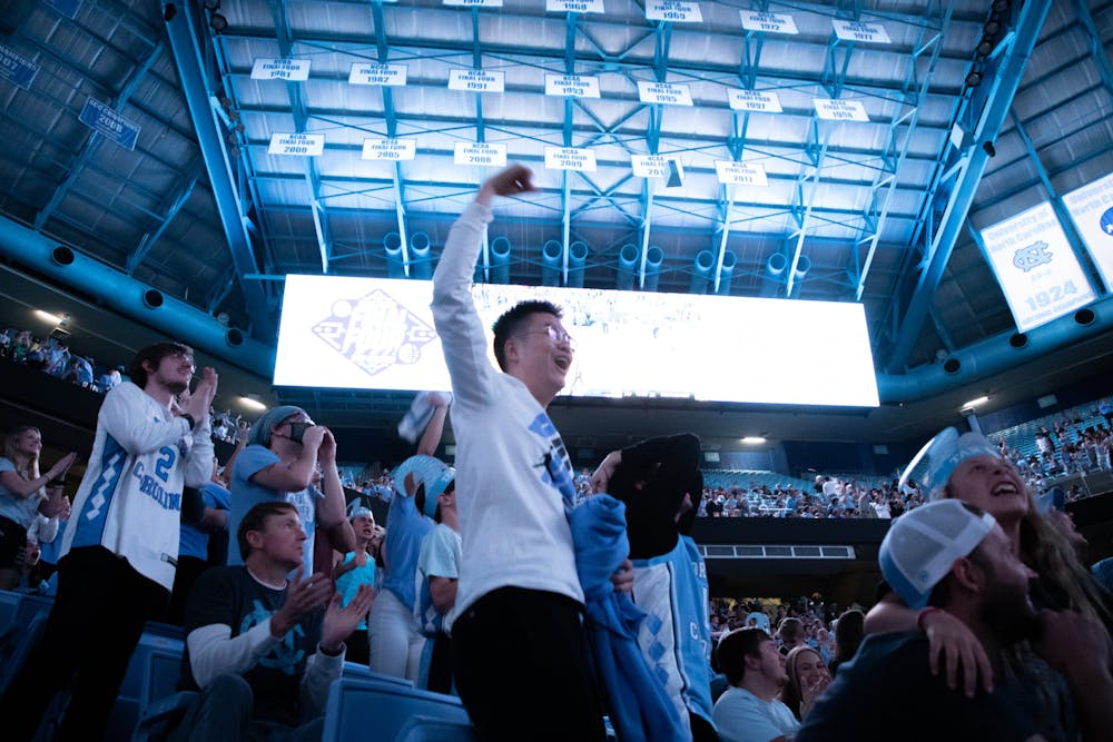Fans celebrate a basket late in the second half of UNC's game against Duke in the Final Four on Saturday, April 2, 2022. UNC won 81-77.