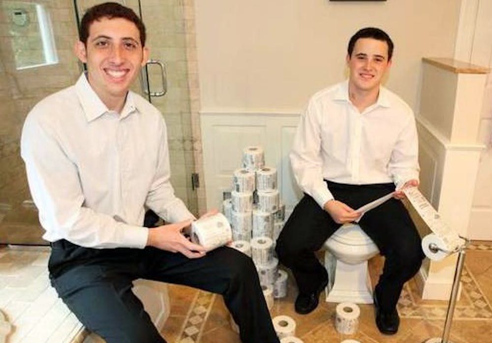 	Jordan Silverman, left, and his brother Bryan, right, started Star Toilet Paper about a year ago.  The idea is to sell ads and then print them on the paper.