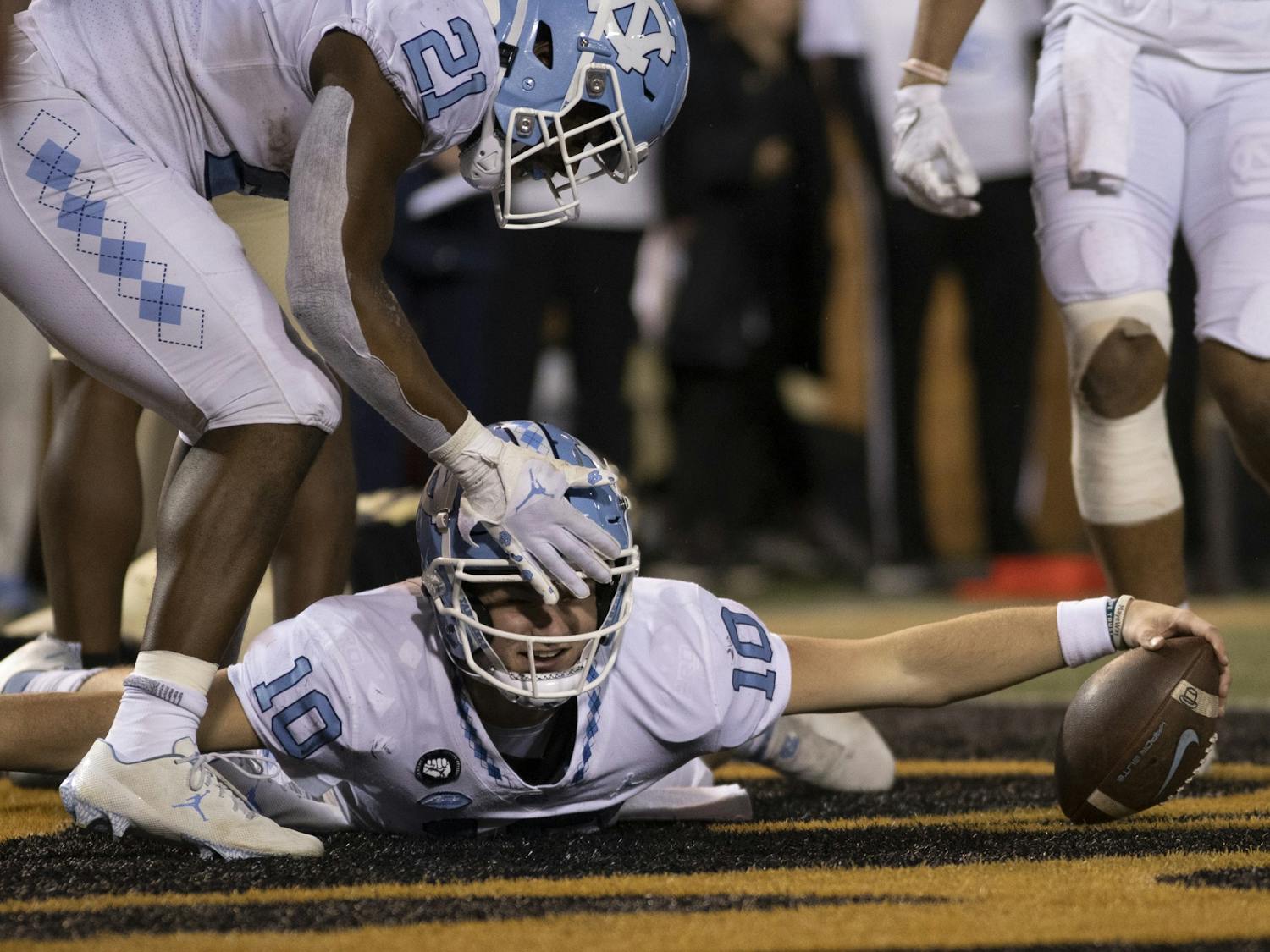 Drake Maye celebrates in the endzone after a touchdown at Truist Stadium on Saturday Nov. 12, 2022. UNC won 36-34.