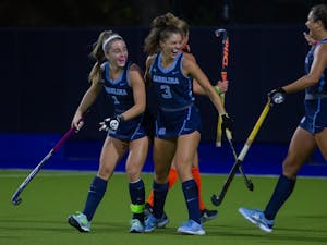 Members of the UNC Field Hockey team celebrate after junior forward Erin Matson (1) scores the second goal of the game against Syracuse. The Tar Heels won the ACC Semifinals with a 4-3 score on Friday, Nov. 6, 2020.