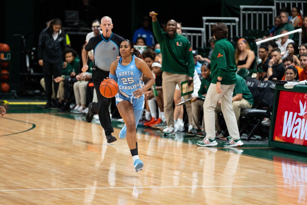 UNC junior point guard Deja Kelly (25) brings the ball up the court in North Carolina's game at Miami on Thursday, Jan. 5, 2023. UNC fell to the Hurricanes, 62-58. Photo courtesy of UNC Athletic Communications.