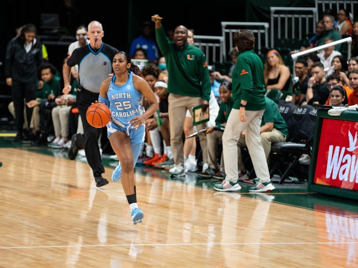 UNC junior point guard Deja Kelly (25) brings the ball up the court in North Carolina's game at Miami on Thursday, Jan. 5, 2023. UNC fell to the Hurricanes, 62-58. Photo courtesy of UNC Athletic Communications.