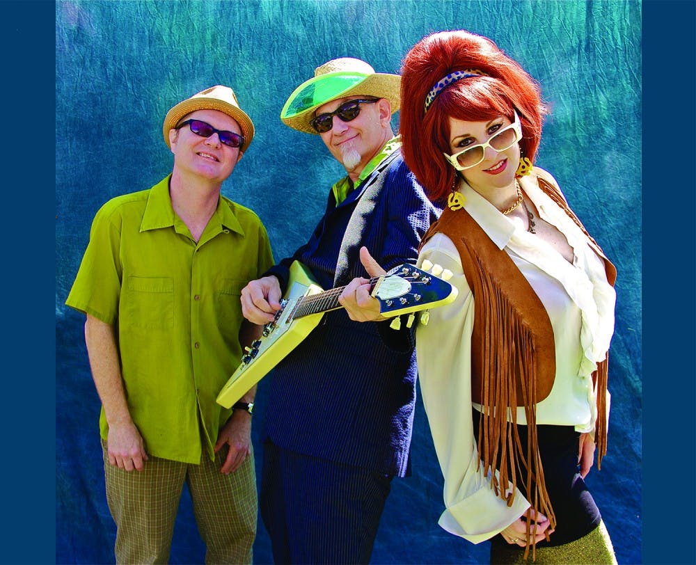 (Left) Dave Hartman (Drums), Rick Miller (Guitar/Vocals), and Mary Huff (Bass/Vocals) are Southern Culture on the Skids.