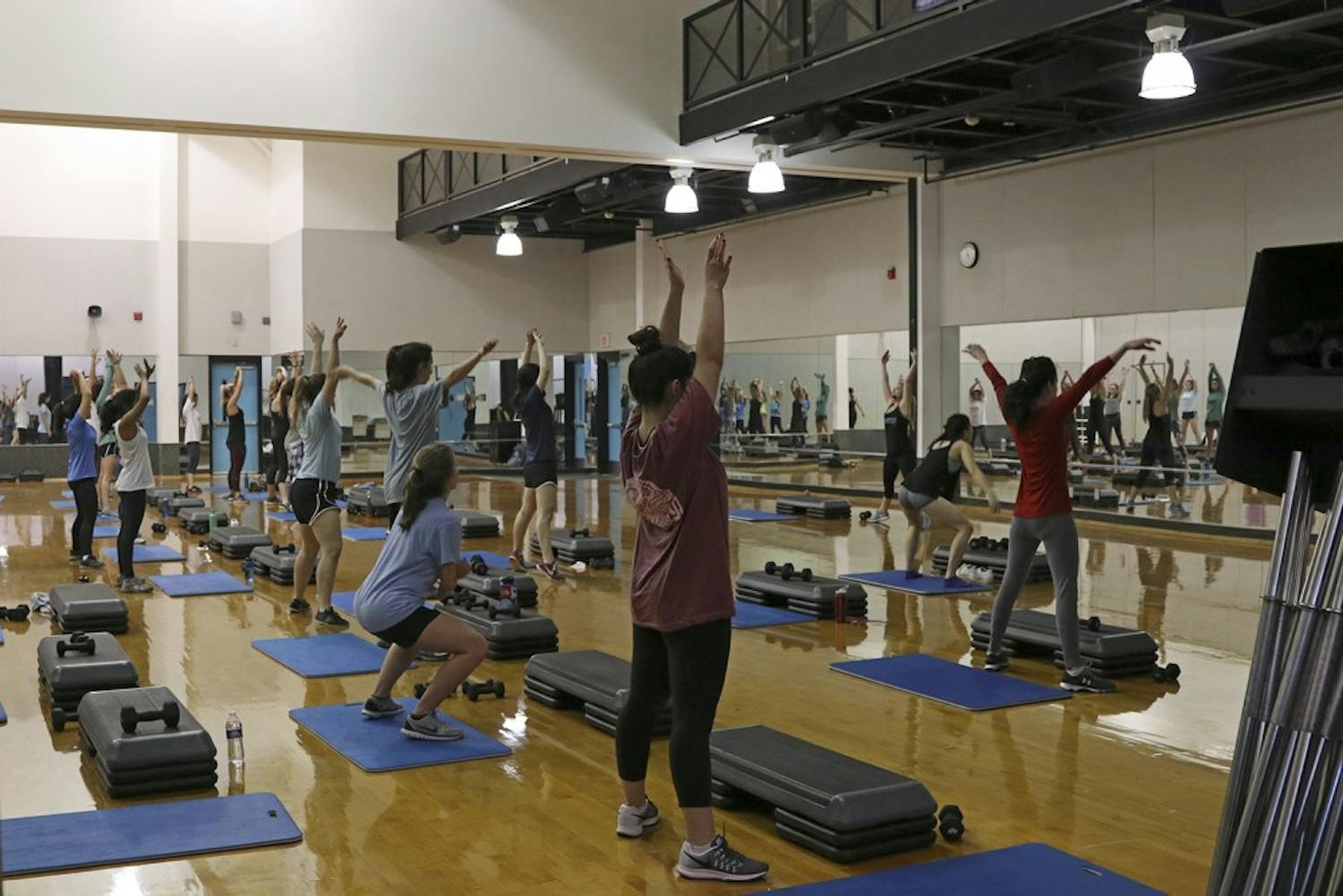 Students, faculty and employees participate in exercise classes in the Student Recreation Center on Tuesday. 