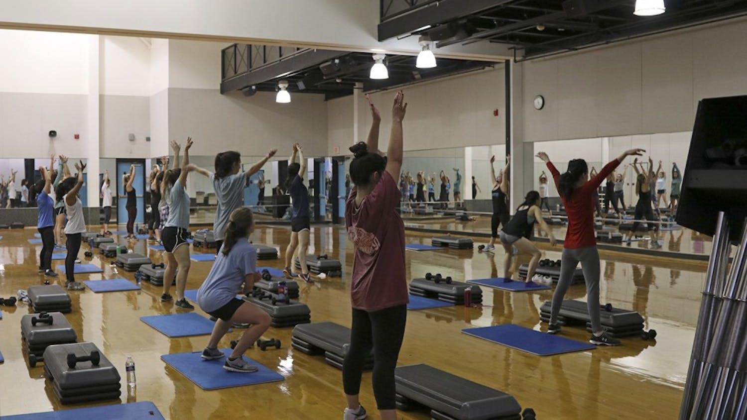 Students, faculty and employees participate in exercise classes in the Student Recreation Center on Tuesday. 