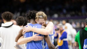 UNC graduate forward Brady Manek (45) embraces senior forward Leaky Black (1) after victory in the Final Four of the NCAA Tournament against Duke in New Orleans on Saturday, April 2, 2022. UNC won 81-77.