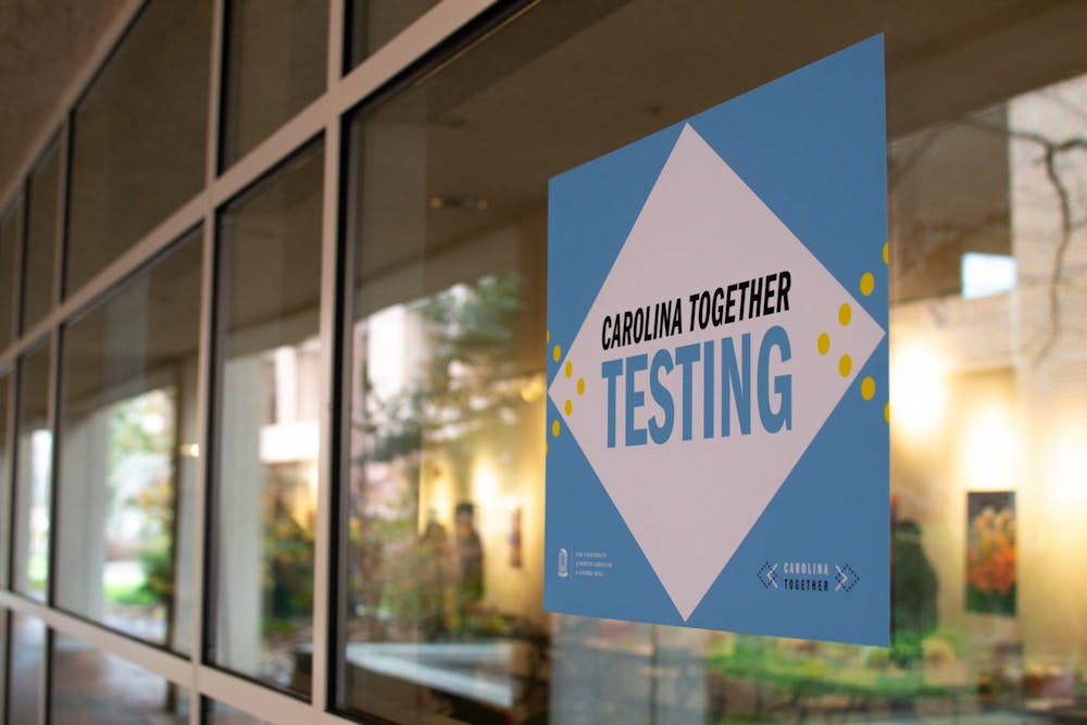 Signage for students receiving their re-entry COVID test at the Frank Porter Graham Student Union is displayed in the gallery space on January 16, 2021.