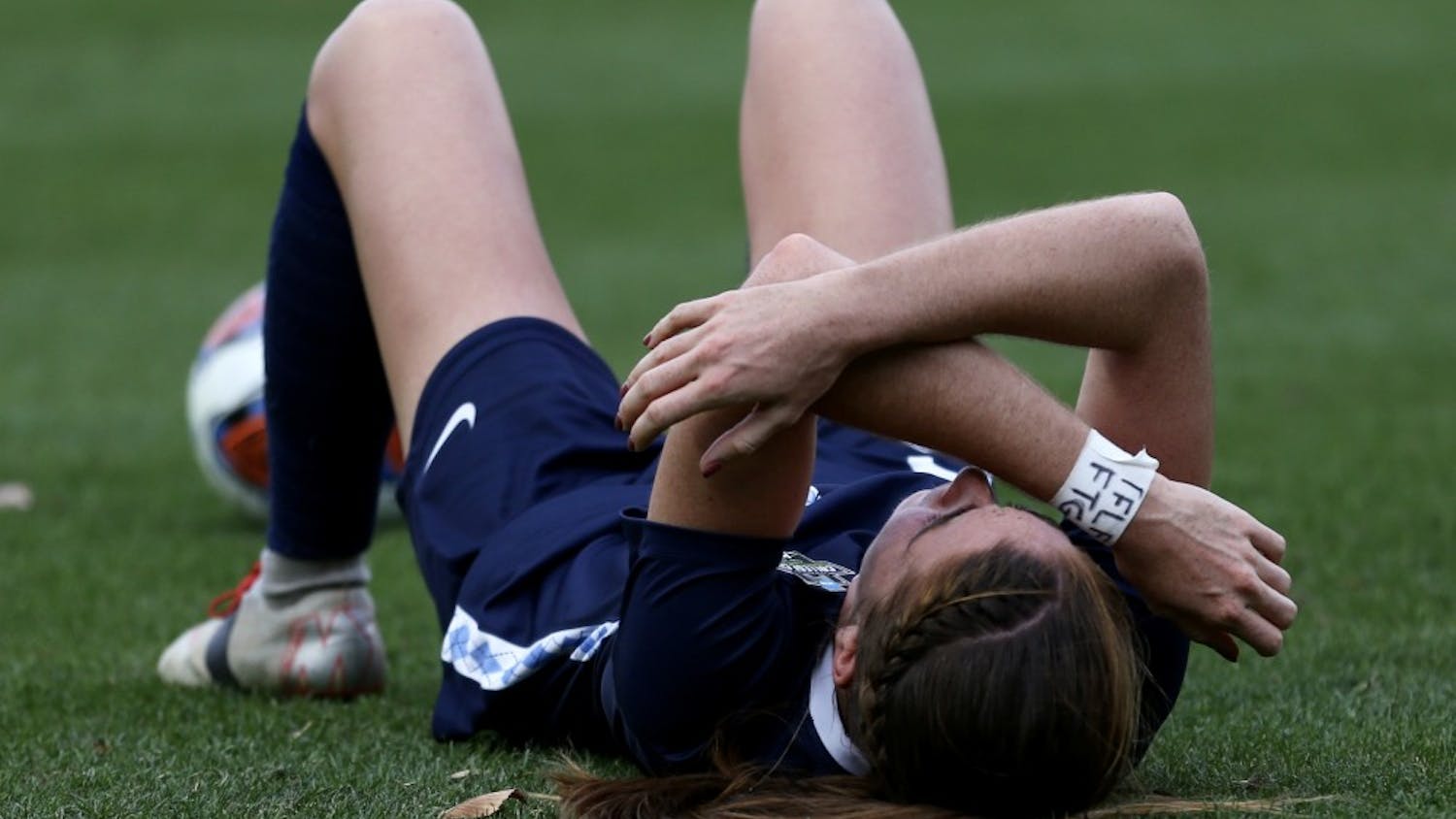 UNC senior defender Julia Ashley lays on the ground in anguish following UNC's 1-0 loss to Florida State in the National Championship game at Sahlen's Stadium at WakeMed Soccer Park in Cary on Dec. 2, 2018.