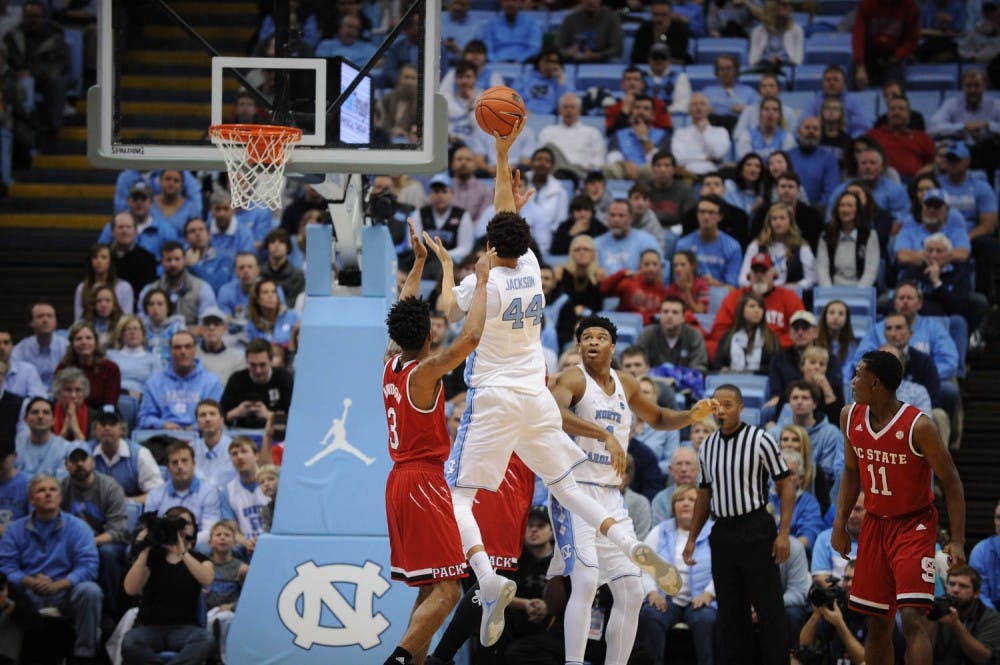 Forward&nbsp;Justin Jackson&nbsp;(44) goes up for a shot over N.C. State defenders Sunday afternoon.&nbsp;