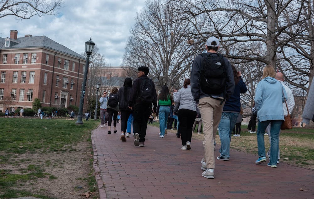 UNC students walk through Polk Place on Feb. 27, 2023. 