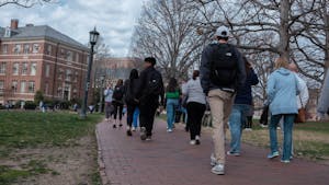 UNC students walk through Polk Place on Feb. 27, 2023. 