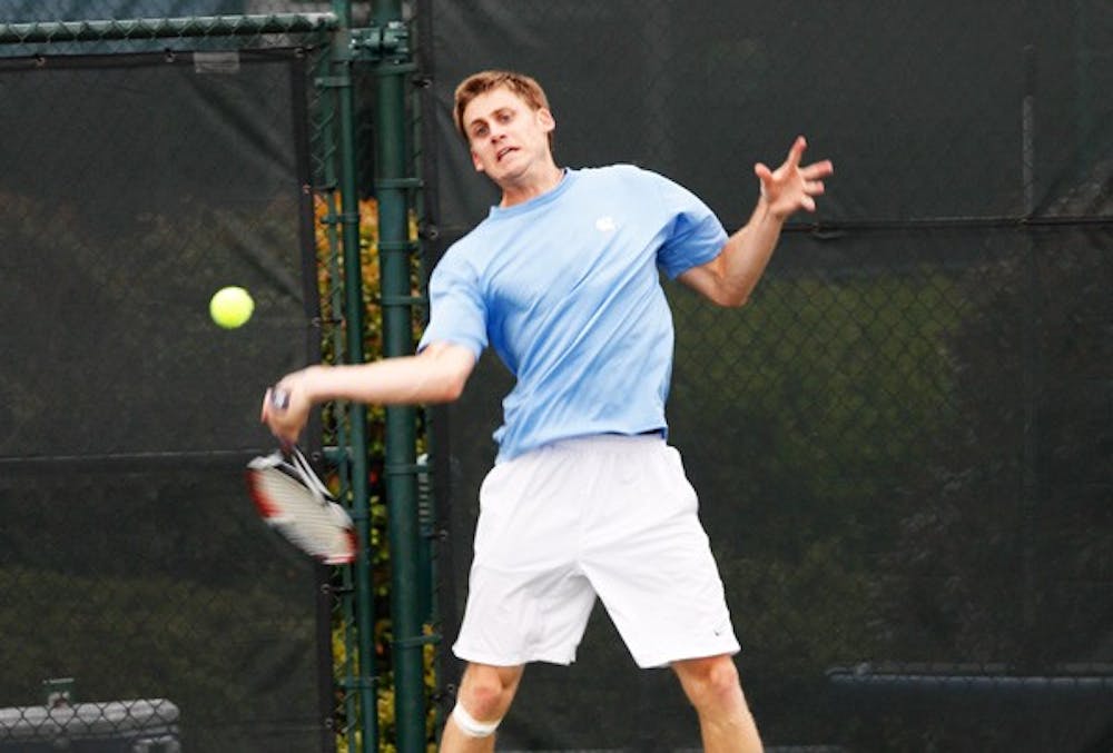 Senior Andrew Crone lobs a forehand in his defeat of Wake Forest’s Zach Leslie. DTH/Alyssa Champion
