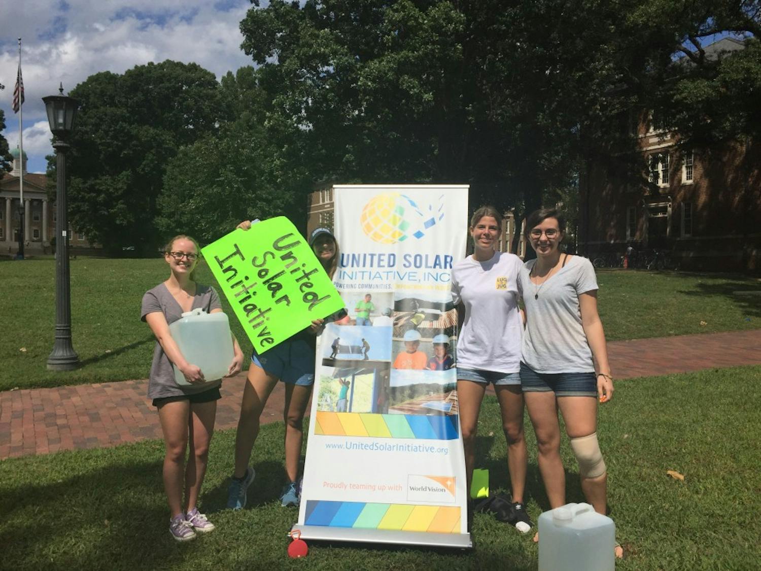 United Solar Initiative volunteers promote Lug-a-Jug on the Quad Wednesday afternoon.