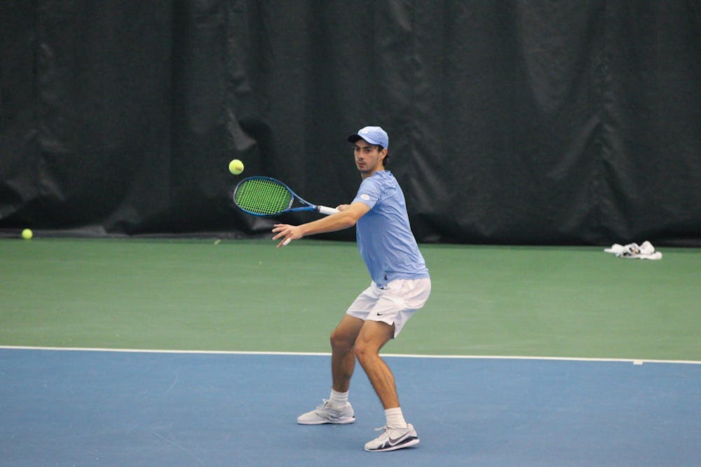UNC sophomore Logan Zapp returns a volley during the Tar Heels’ 4-2 victory over South Carolina in the Cone-Kenfield Tennis Center on Feb. 13, 2022.