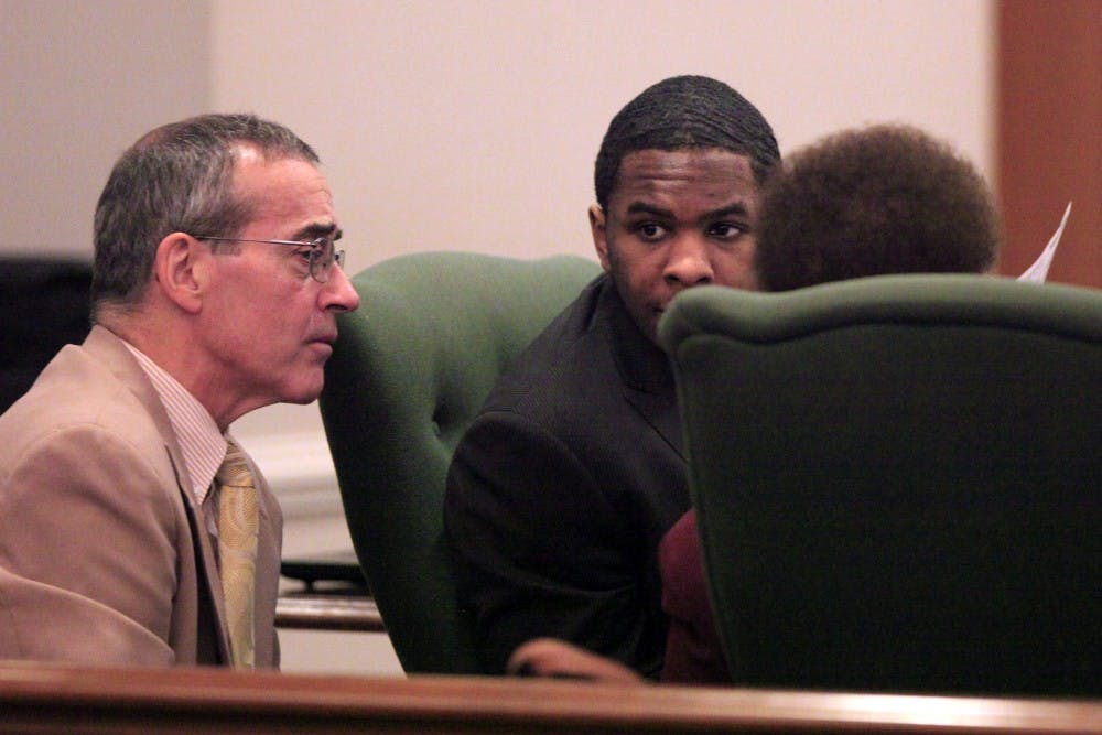 Laurence Alvin Lovette Jr. talks to his lawyers Kevin Bradley and Karen Bethea-Shields Tuesday, Dec. 20, 2011.  A jury found Lovette guilty of kidnapping, robbing and murdering Eve Carson, the 2008 UNC-Chapel Hill student body president. He received a life prison sentence without the possibility of parole.The verdict capped seven and a half days of testimony in Orange County Superior Court.
