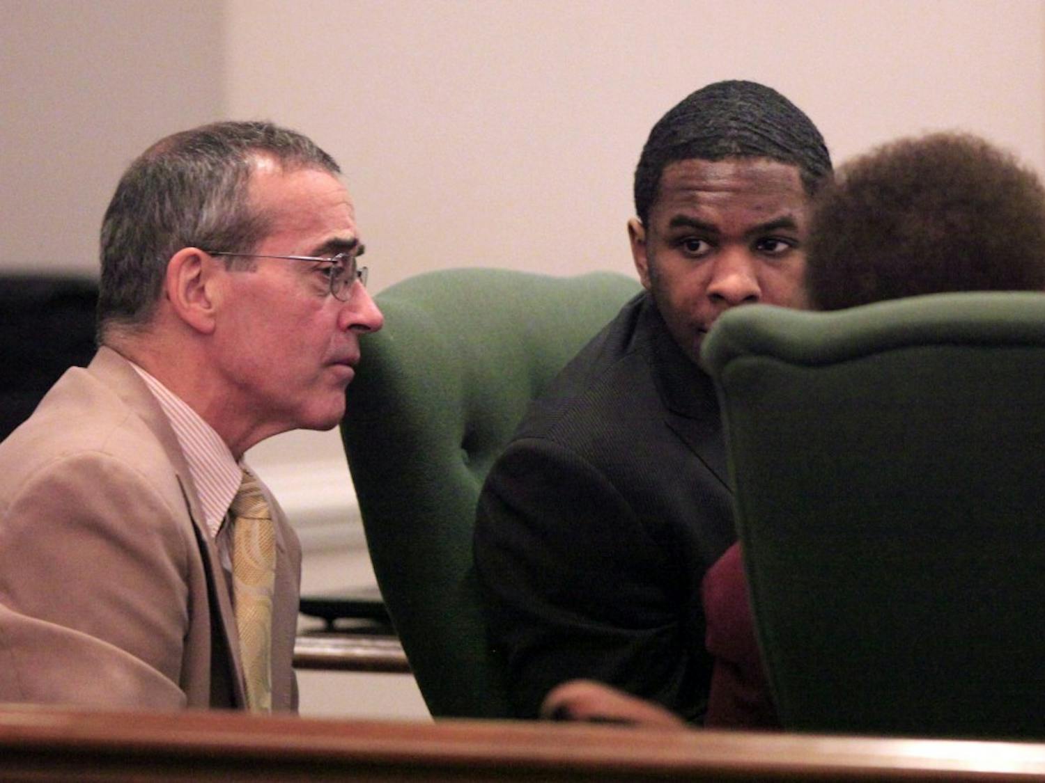 Laurence Alvin Lovette Jr. talks to his lawyers Kevin Bradley and Karen Bethea-Shields Tuesday, Dec. 20, 2011.  A jury found Lovette guilty of kidnapping, robbing and murdering Eve Carson, the 2008 UNC-Chapel Hill student body president. He received a life prison sentence without the possibility of parole.The verdict capped seven and a half days of testimony in Orange County Superior Court.