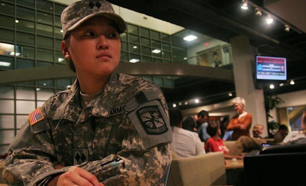 Kristi McNair, a journalism major from Okinawa, Japan, sits in her Army ROTC uniform in the Student Union. DTH/Lauren McCay