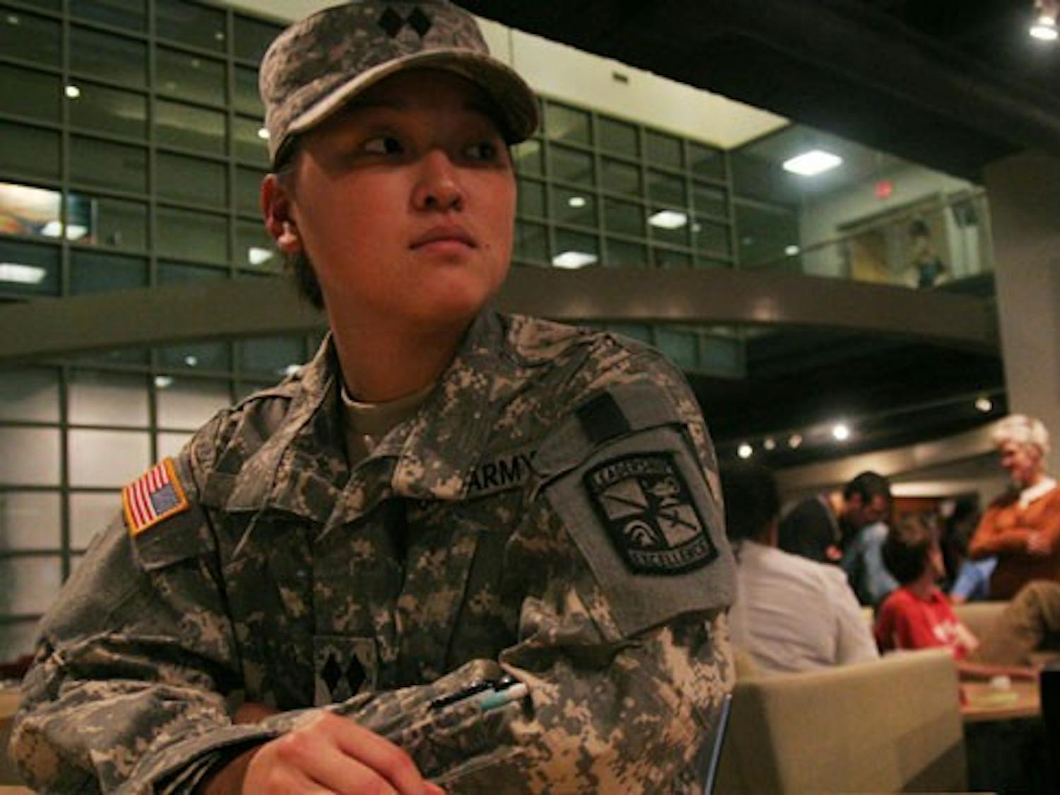 Kristi McNair, a journalism major from Okinawa, Japan, sits in her Army ROTC uniform in the Student Union. DTH/Lauren McCay