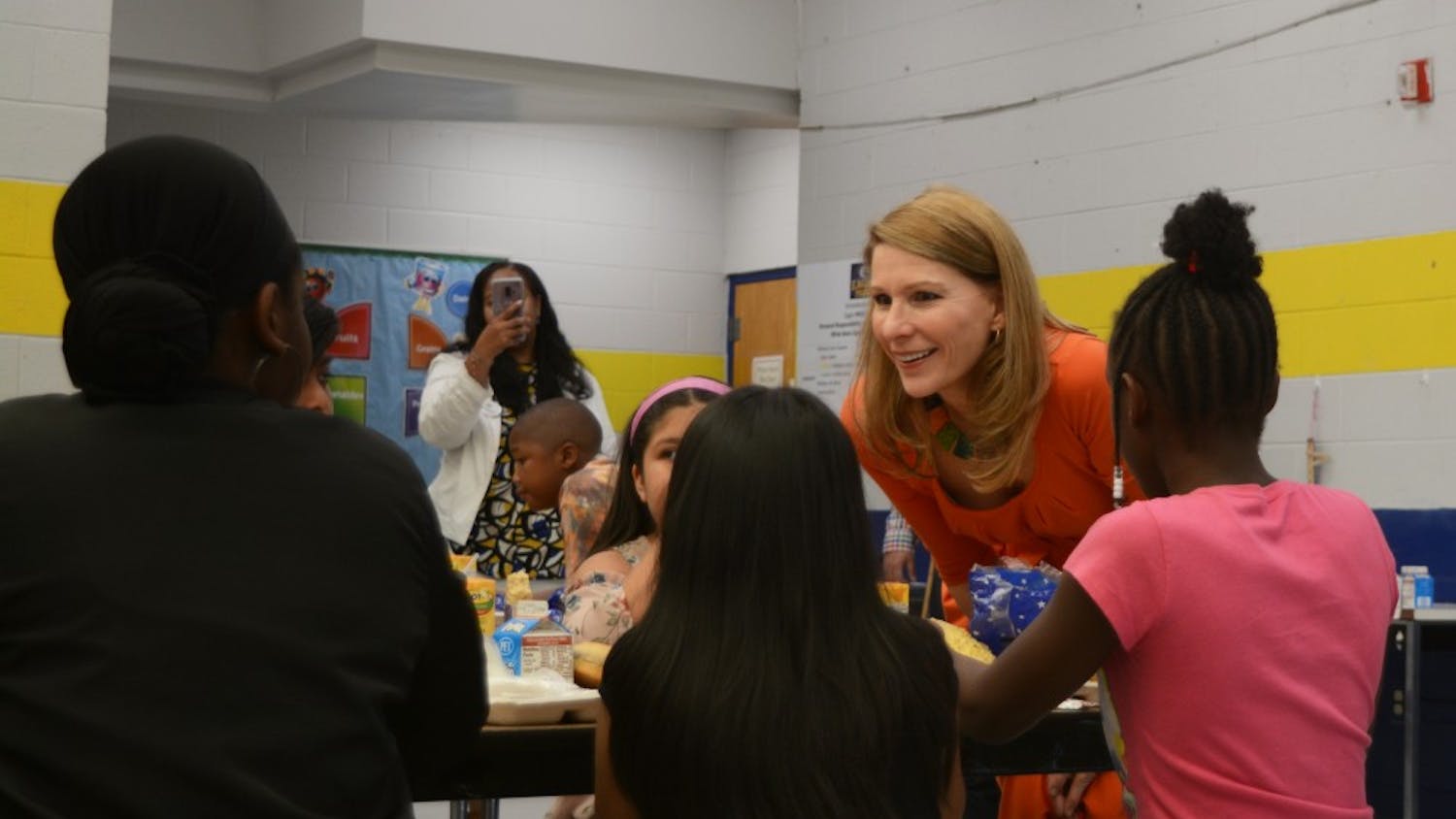 First Lady Kristin Cooper meets some of the ECDI summer program participants on Tuesday in Durham. 