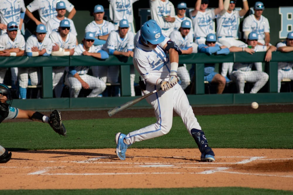 UNC infielder/outfielder and freshman Vance Honeycutt (7) swings at the ball during UNC's first game in a series of three against Coastal Carolina on March 4, 2022, in Chapel Hill, NC. UNC won that game 4-3.