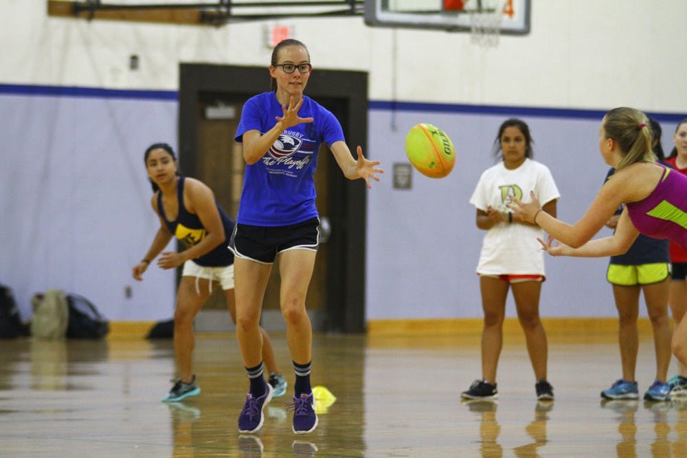 Alicia Wood, a senior environmental science major, prepares to catch the ball during a practice exercise.