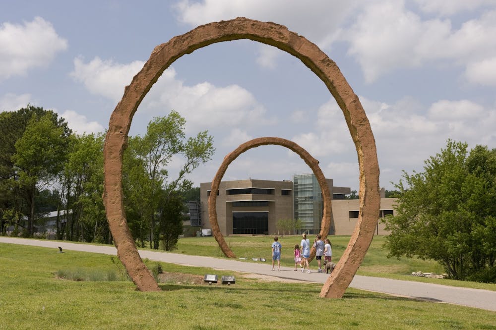 <p>Visitors walk by Thomas Sayre's sculpture "Gyre" at the North Carolina Museum of Art. The museum, among other organizations, has taken to social media to promote the arts. Photo courtesy of Kat Harding.&nbsp;</p>