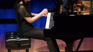 UNC Associate Professor of Music and Head of Keyboard Studies Clara Yang performs on the piano. Yang will perform virtually alongside jazz pianist Aaron Diehl on June 4. Photo courtesy of Carolina Performing Arts.
