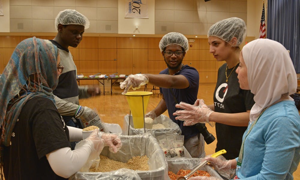 Volunteers from the UNC Muslim Student Association partnered with Rise Against Hunger (formerly Stop Hunger Now) to host a meal-packaging event in the Great Hall on Sunday, February 12. The event was held in remembrance of Our Three Winners.