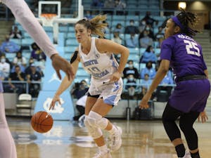 UNC redshirt junior Eva Hodgson drives the ball down the court during a women's basketball game against James Madison University on Sunday, Dec. 5, 2021. 
