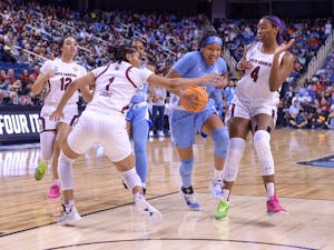 Sophomore guard Kennedy Todd-Williams (3) fights to defend the ball in the UNC women’s basketball game against No. 1 South Carolina on Friday, March 25, 2022. The Tar Heels lost, 69-61.
