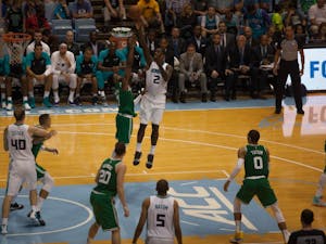 Hornets forward Marvin Williams (2) shoots against Celtics forward Jaylen Brown (7) at the Smith Center Sept. 29. The Charlotte Hornets defeated the Boston Celtics, 104-97, in a preseason game.